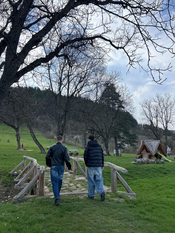 Two men gather in Troyan park on April afternoon