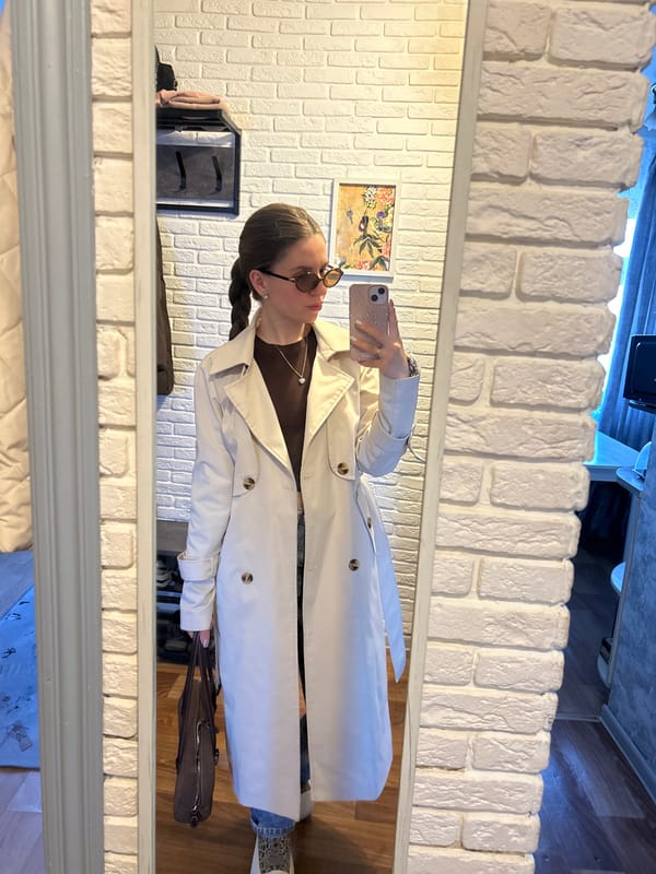 Young woman takes selfies, tries accessories in Klin