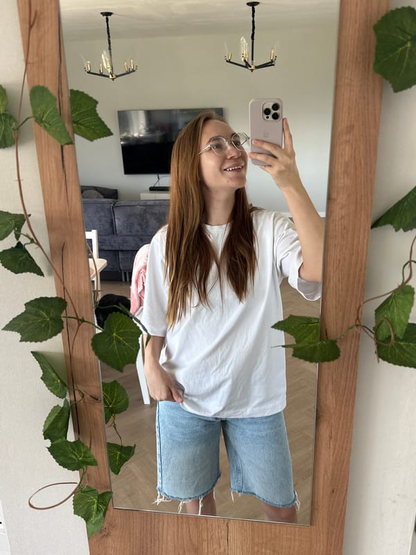 Woman takes mirror selfie in Kharnavy, Russia