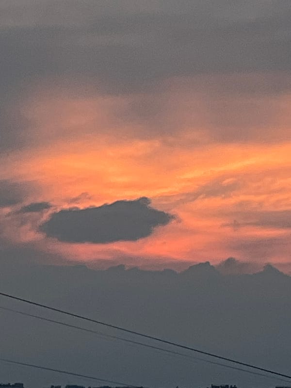 Sunset clouds over a Russian town, caught from multiple angles