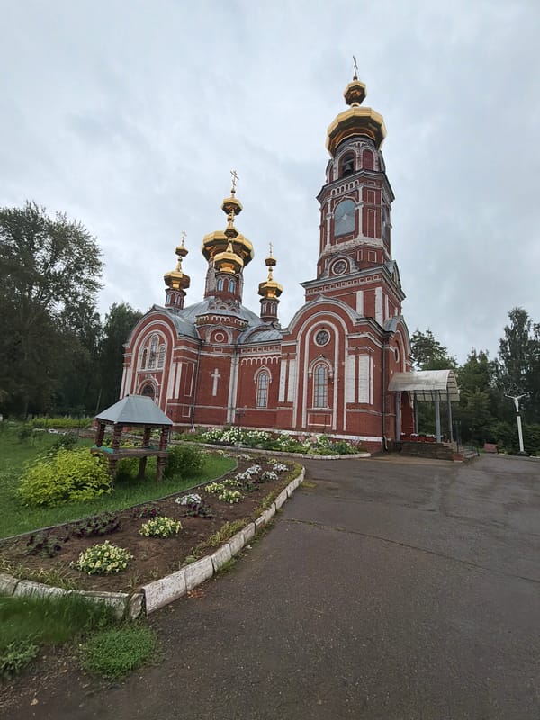 Orthodox church with golden domes in Osa, Russia