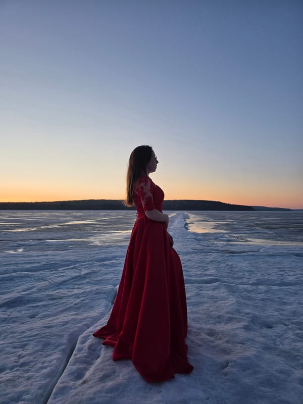 Woman in red dress photographed at sunset in Chaikovsky