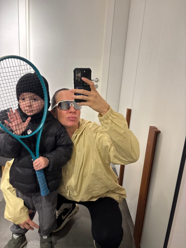 Adult and child photographed together indoors in Chaikovsky