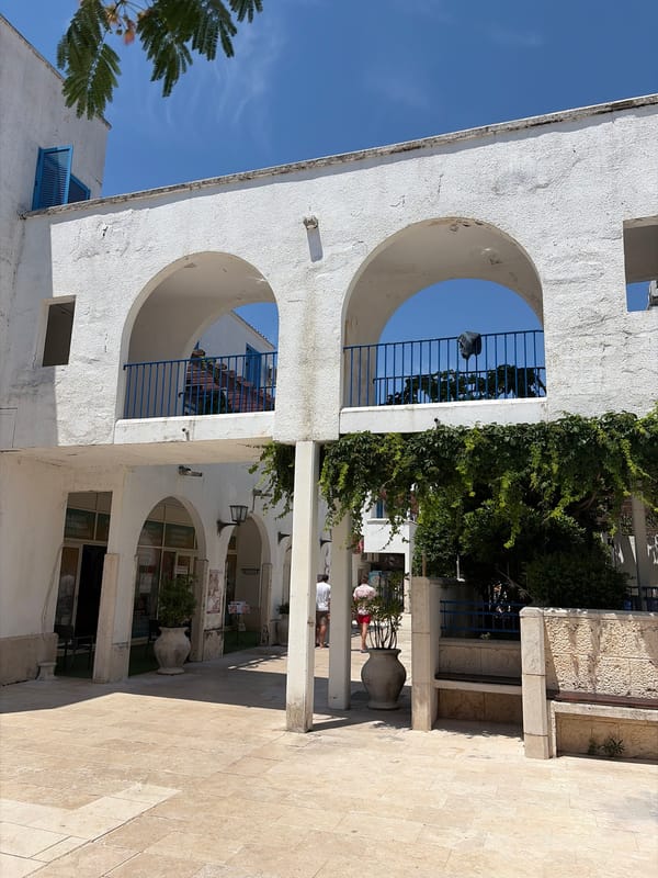 Morning stroll through sunny Budva captures Mediterranean architecture and beach life