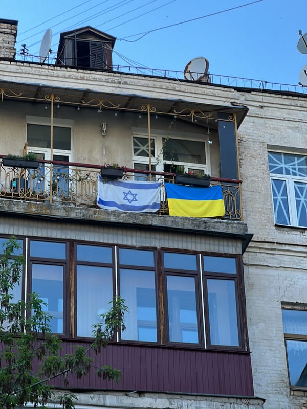 Israeli and Ukrainian flags displayed together on Kyiv balcony