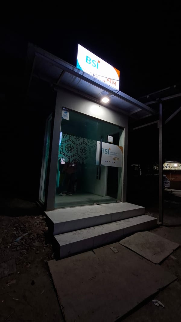 Night scenes from Beurandang: streets, cats, and a lit ATM