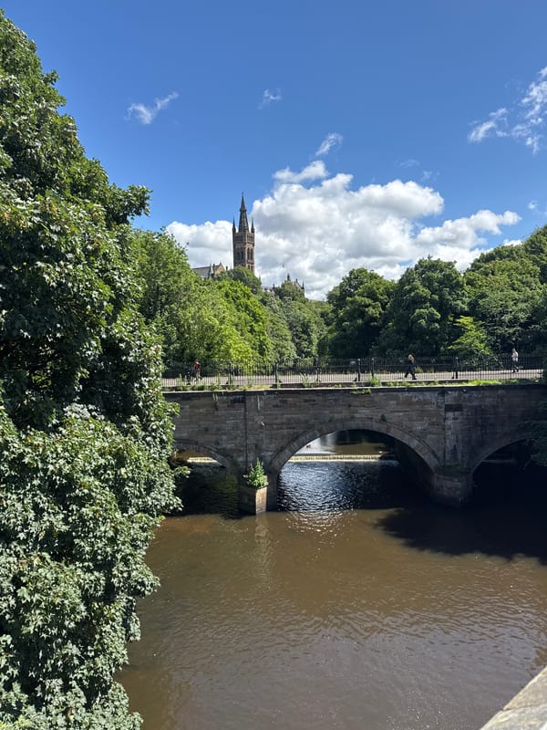 Glasgow landmarks and riverbanks on a bright summer morning