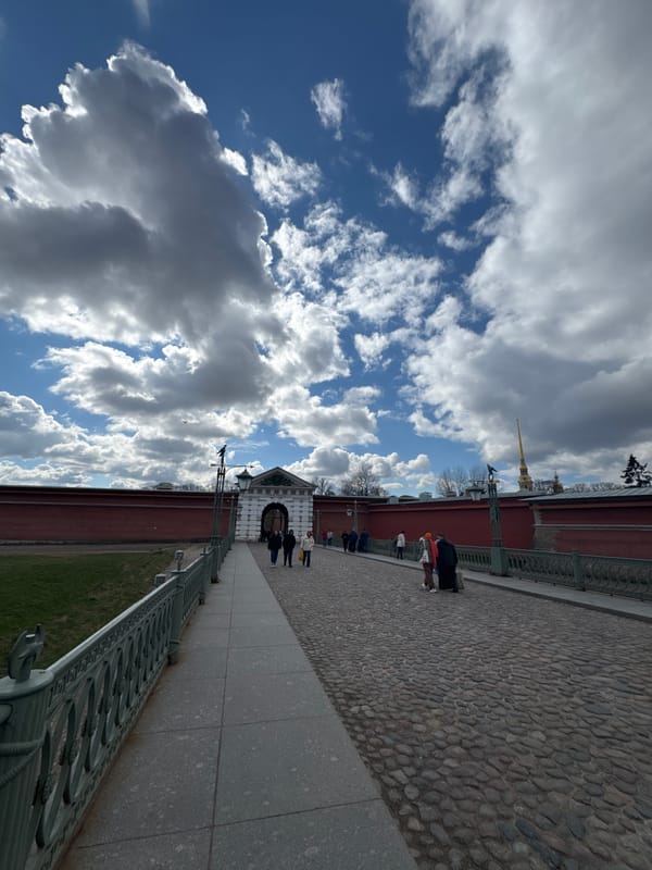 Tourist documents Saint Petersburg landmarks during morning walking tour