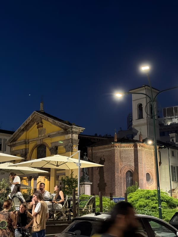Evening outdoor dining scene documented in Milan, Italy