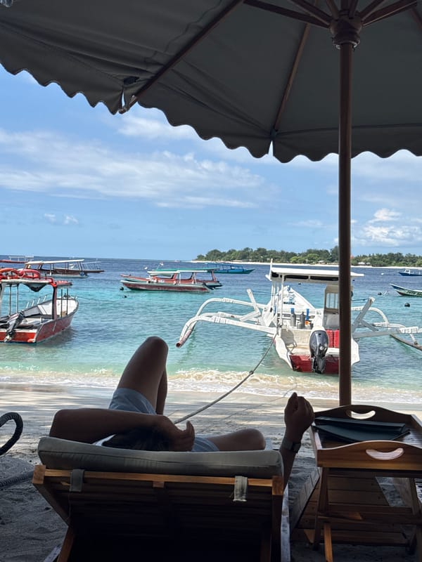 Morning boats captured from Indonesian beachside umbrella perspective