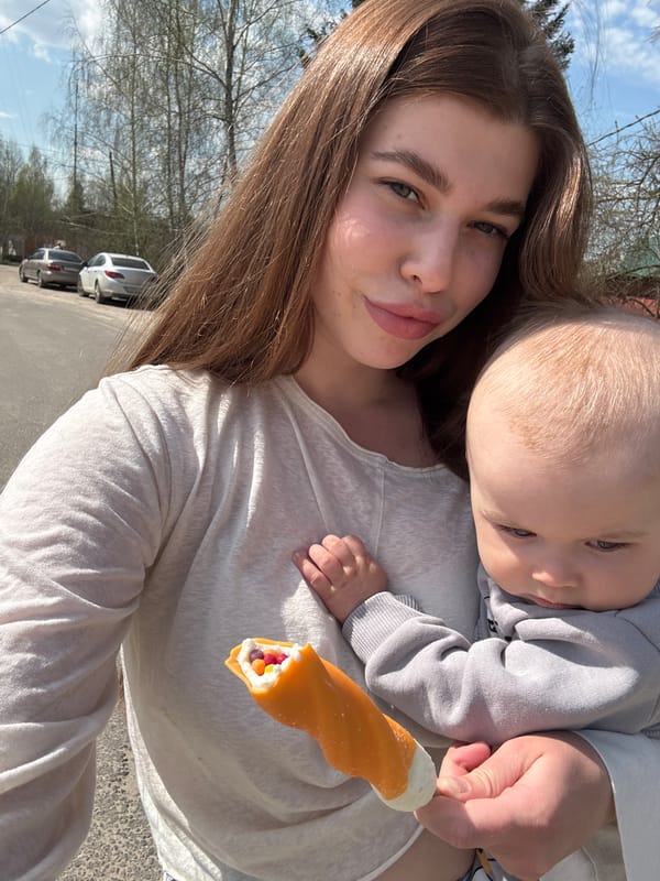 Mother and child moment, candy treat captured in Шевлягино
