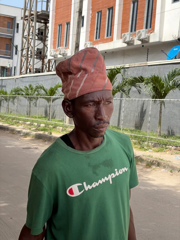 Man in Champion shirt observed on street in Igboefon
