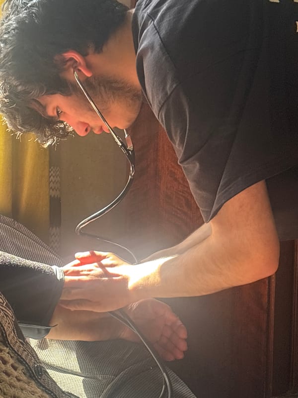 Man Takes Own Blood Pressure in Yerevan Home