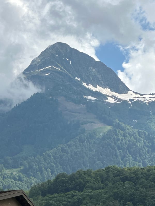 Snow-capped peaks and misty skies over Estosadok, Russia