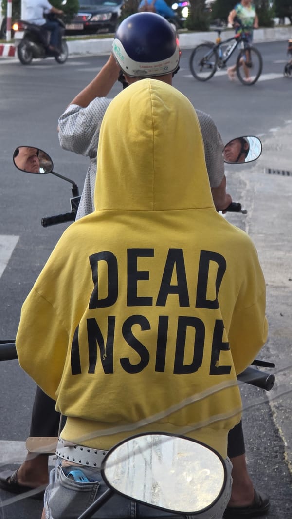 Scooter rider spotted wearing "DEAD INSIDE" hoodie in Vietnam