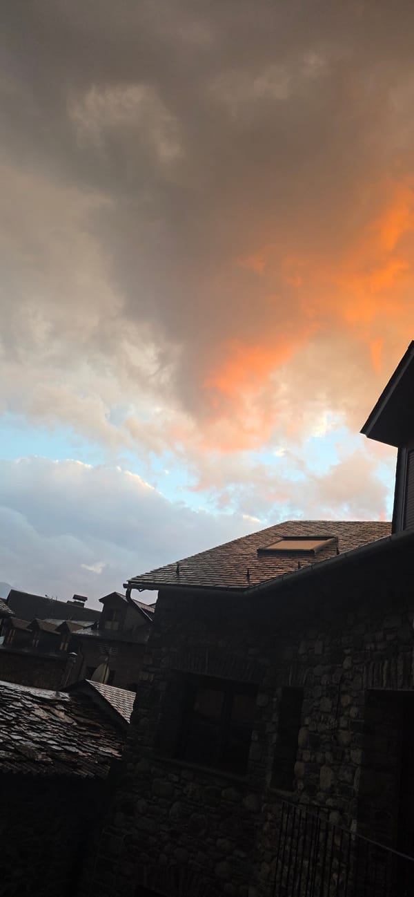 Dramatic sunset illuminates mountain town of Benasque, Spain