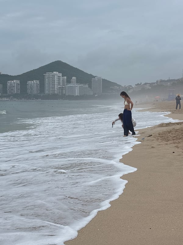 Waves, red lanterns, and beachside activity in Jiyang District