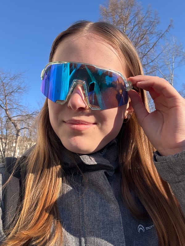 Person poses with futuristic sunglasses in early morning Berezniki