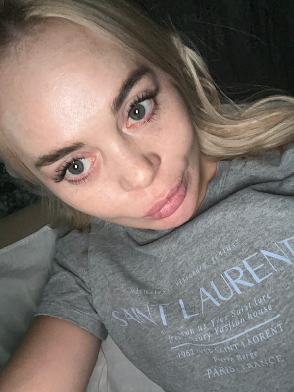 Extended bedroom selfie session in a Saint Laurent sweatshirt.