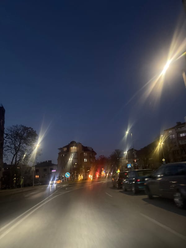 Evening traffic moves through illuminated Blagoevgrad streets