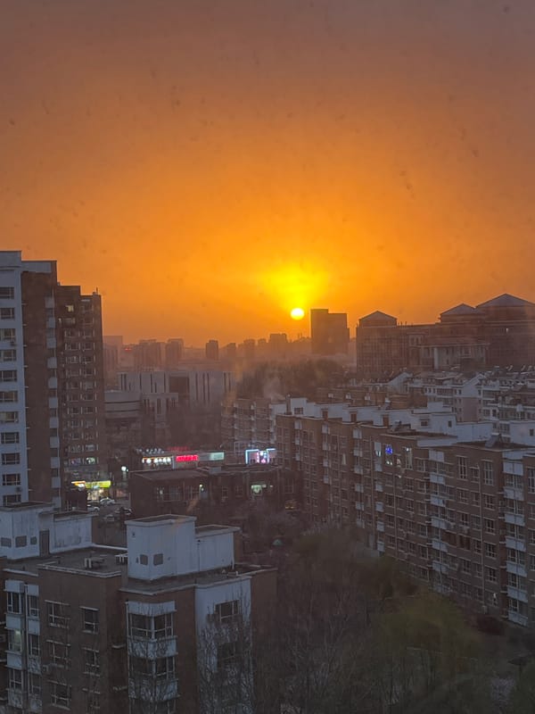 Witness documents vibrant sunset over Changchun cityscape from window