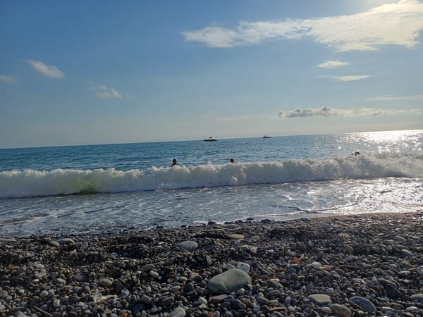 Sunny afternoon on Sochi's Black Sea pebble beach