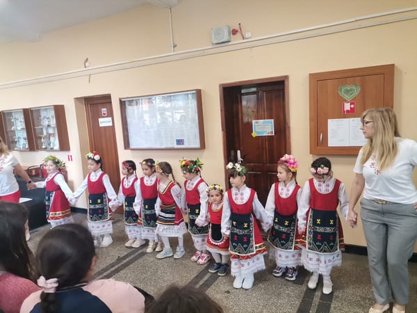Bulgarian girls perform traditional folk dance in costumes