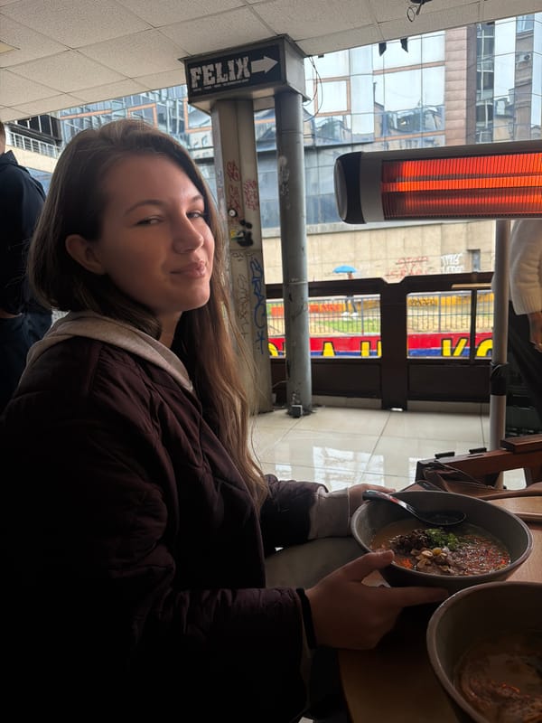 Lunch patron enjoys ramen and beer at Belgrade restaurant