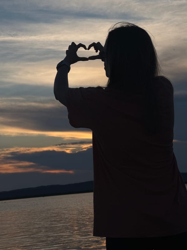 Woman enjoys sunset photo session at Chaikovsky waterfront