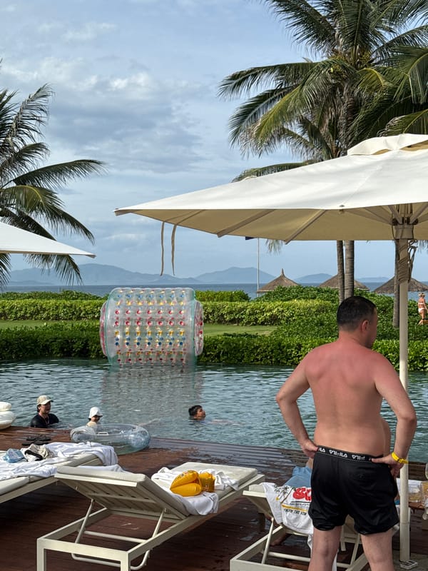 Quiet morning at a Vietnamese beachside resort, pool and grounds