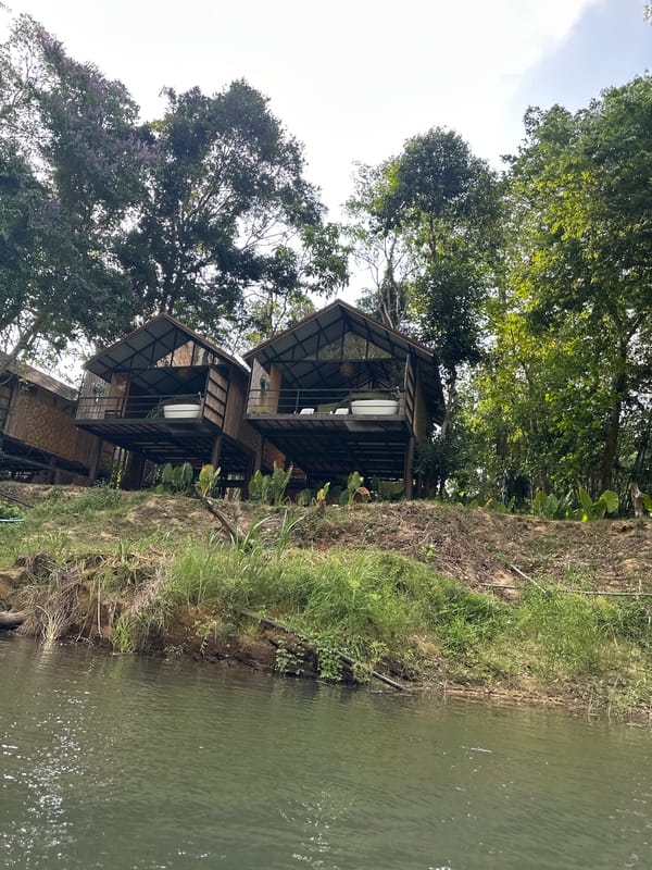 Stilted bungalows captured along Khlong Sok waterfront, Thailand