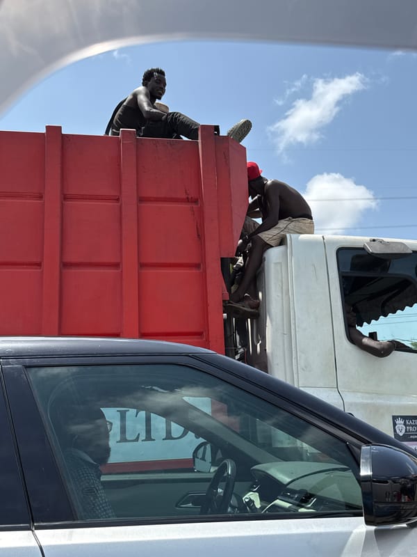 People hitch rides on truck in Lekki, Nigeria