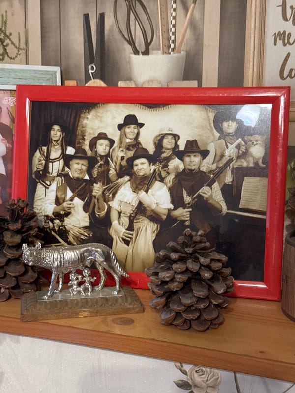 Eclectic decorative shelf in Almaty, clocks, figurines, and curiosities