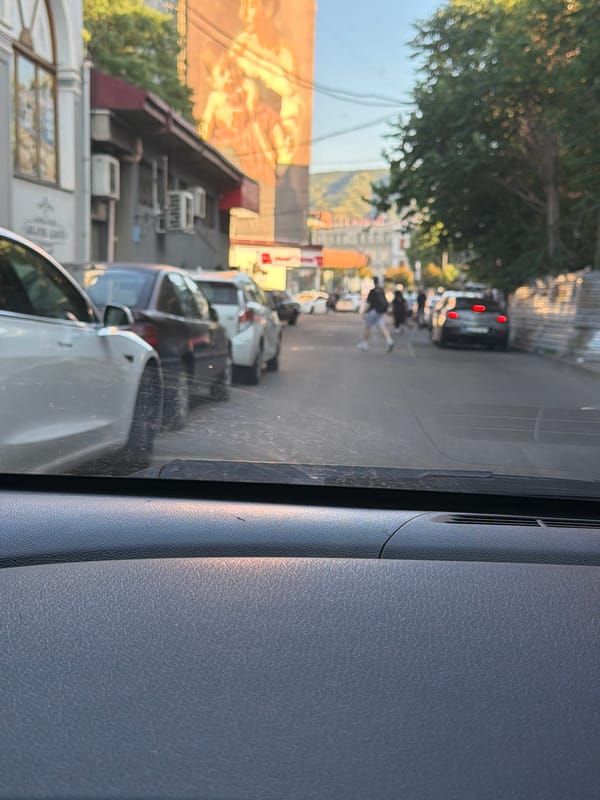 Tbilisi street life: traffic, food stalls, and vendors midafternoon
