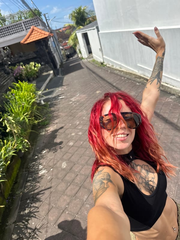 Tattooed couple walks poodle through North Kuta streets