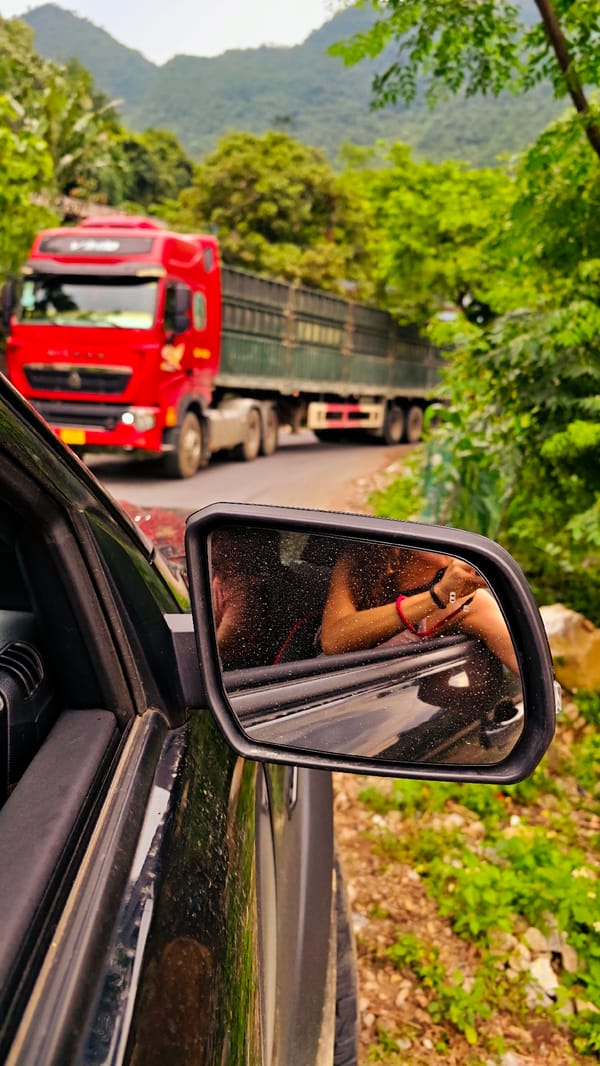 Rural road traffic and daily life documented in Vietnamese mountain commune