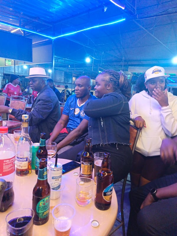 Group gathers at crowded table in Nairobi establishment