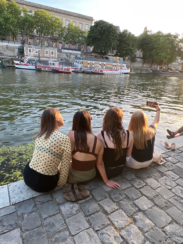 Parisians gather along Seine River embankments for sunset socializing