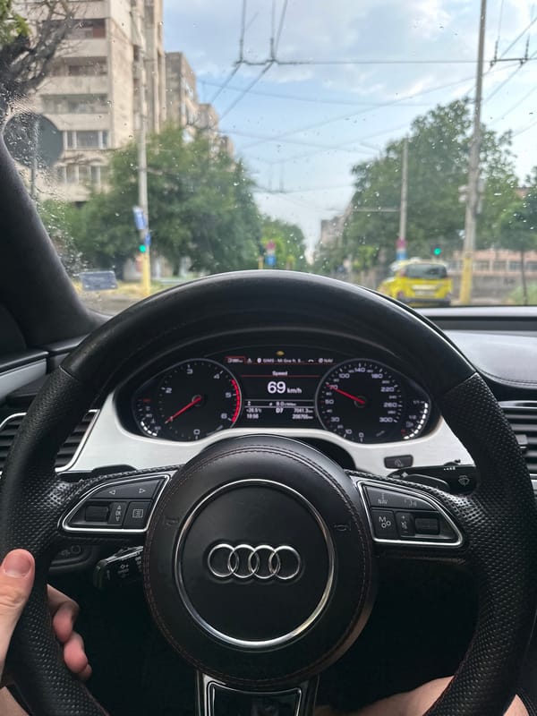 Driving through rainy Ruse in an Audi, July afternoon