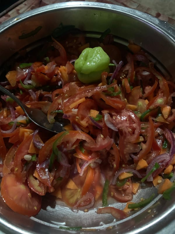 Fresh vegetable salad with Scotch bonnet pepper prepared in Dar es Salaam