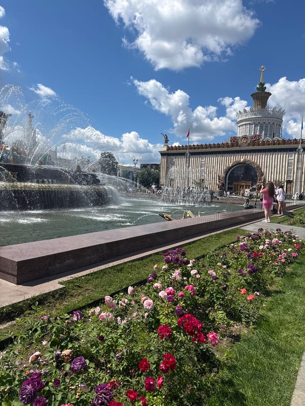 Summer morning at VDNKh: fountains, flowers, craft market, and reenactors