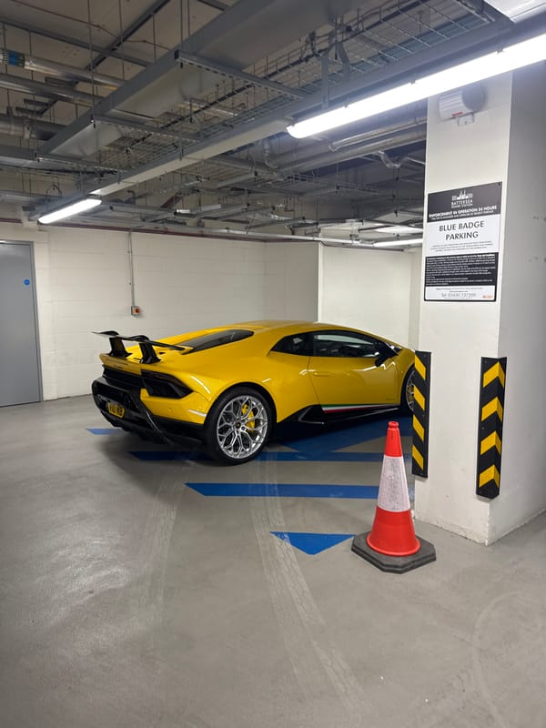 Sports car illegally parked in disabled space at Battersea