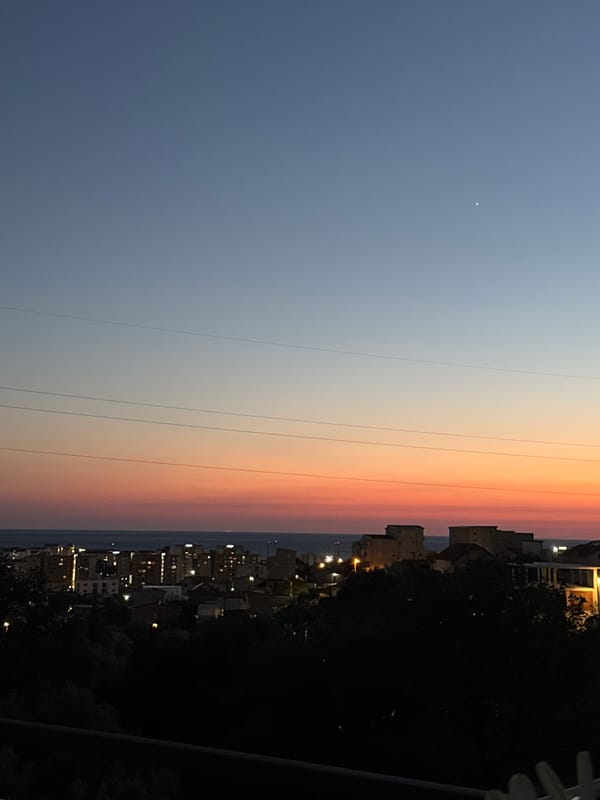 Sunset hour in Sustaš: dusk skies, contrails, and a tortoise