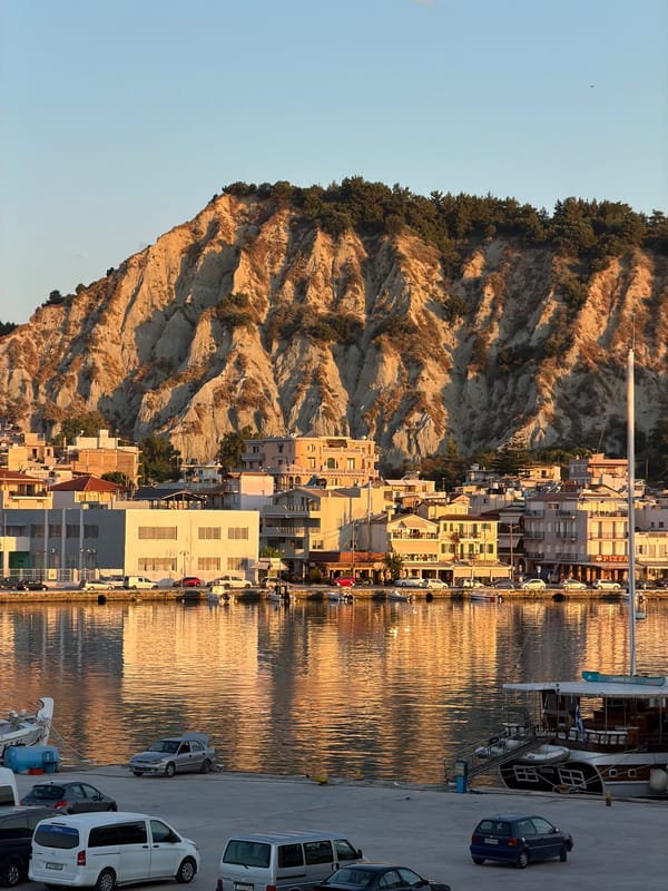Zakynthos harbor at golden hour, port life in full swing