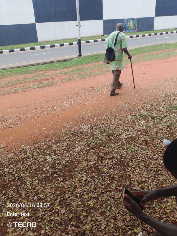 Pedestrians walk dirt paths in Awka, Nigeria