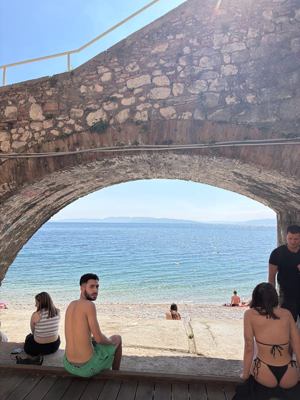 Historic archway frames coastal views in Rijeka, Croatia