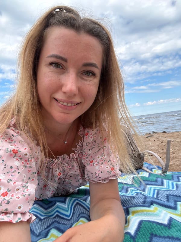 Relaxed beach morning with coffee, blanket, and selfies