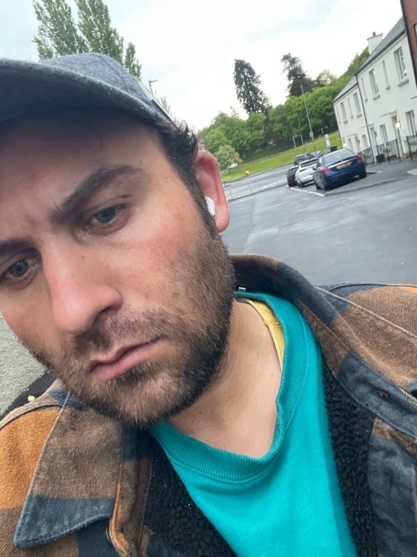 Man in plaid jacket photographed on Armagh street