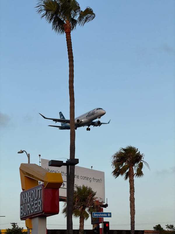 Late-night street life under the LAX flight path