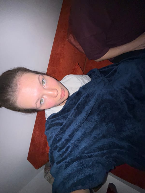 Evening relaxation captured on orange couch in Belgrade suburb